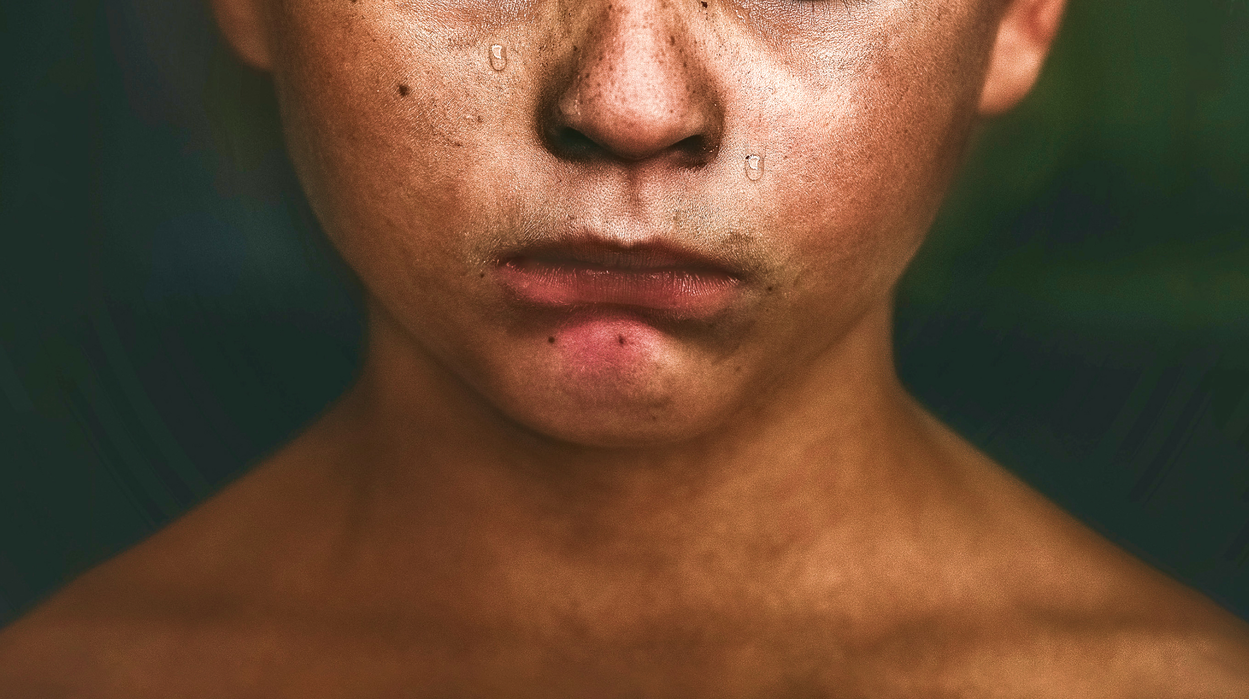 a close up of a person with freckles on his face.