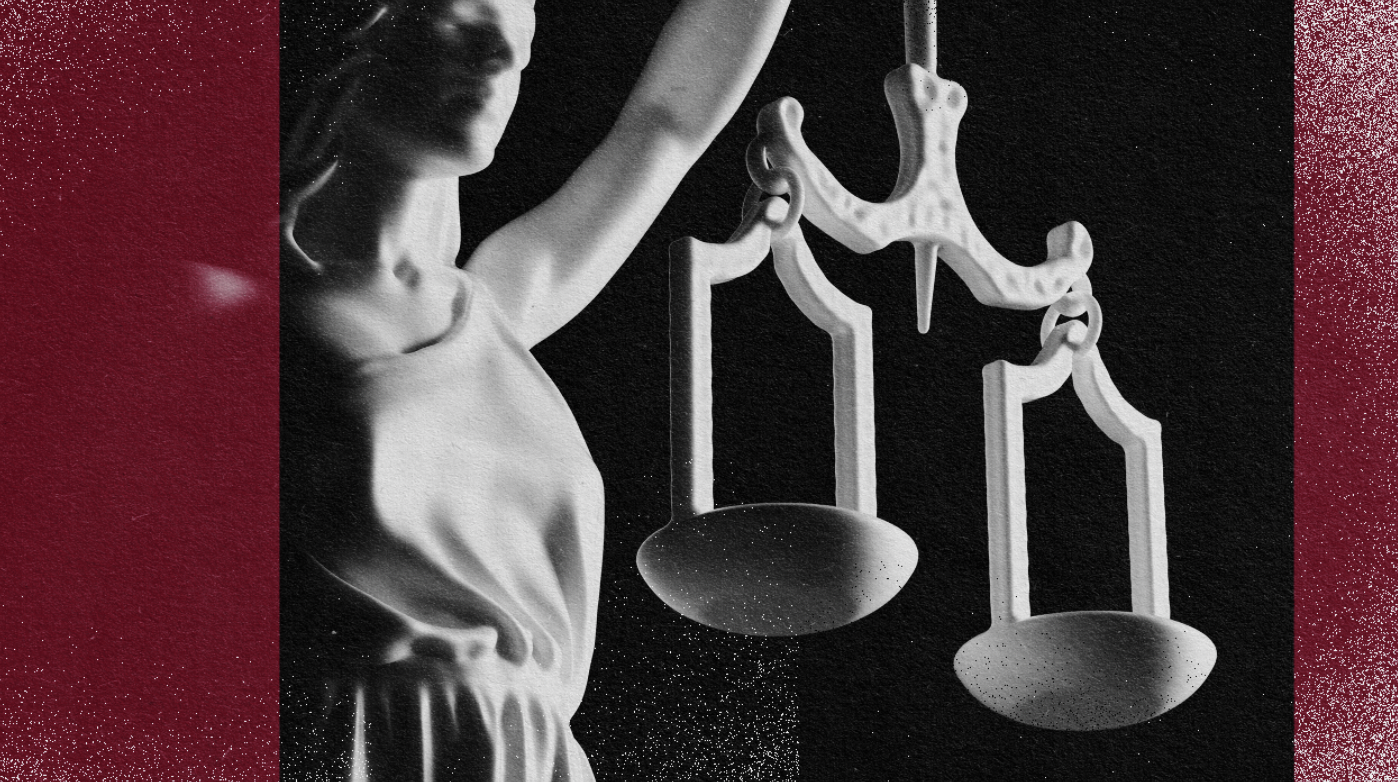 An image of a statue symbolizing human rights, delicately holding scales of justice.